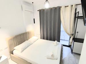 Postel nebo postele na pokoji v ubytování Sunset Hotel