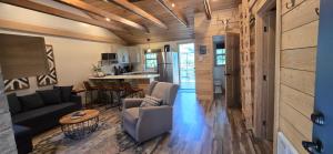 a living room and kitchen in a tiny house at Recreational Therapy- Private 2 Bedroom with Hot Tub and Firepit in Oakland