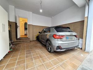 a car is parked in a garage at BHost - Palace in Córdoba