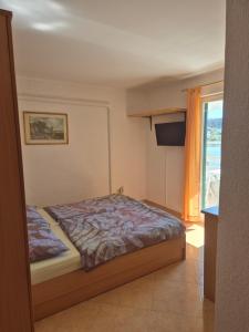 Postel nebo postele na pokoji v ubytování Apartmani Mira