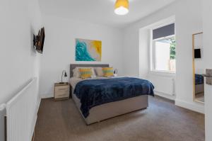 Ένα ή περισσότερα κρεβάτια σε δωμάτιο στο Arran Cottage - 4 Bed Home on M8