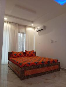 Giường trong phòng chung tại Lamaisu Homes Block 3