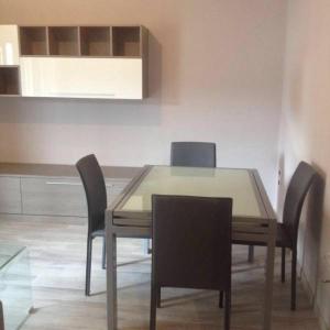 a dining room table and chairs in a room at Fiordaliso in Caulonia Marina