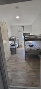 a hallway with bunk beds in a dorm room at Ferienwohnung Schönborn in Schönborn