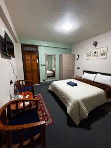 Postel nebo postele na pokoji v ubytování The Silver Spring Homestay