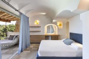 En eller flere senge i et værelse på Villa Pevero Vista Mare Con Piscina e Palestra