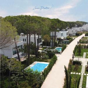 an aerial view of a resort with a swimming pool at Lusso Villa - San Pietro Melia in Draçi