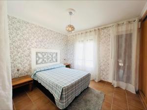 Ένα ή περισσότερα κρεβάτια σε δωμάτιο στο Casa Costa Esuri +42 φωτογραφίες