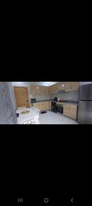 a kitchen with a stove and a counter top at Villa de luxe in Imouzzer Kandar +7 photos