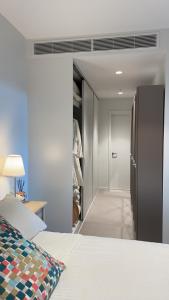 a bedroom with a bed and a walk in closet at Perth Hub in Perth +44 photos