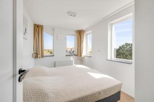 Penthouse Zeezicht - Residence Kabbelaarsbank (6 P) - not for companiesにあるベッド