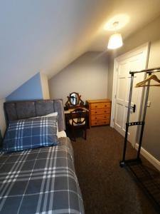 En eller flere senger på et rom på Clone manor Lodge