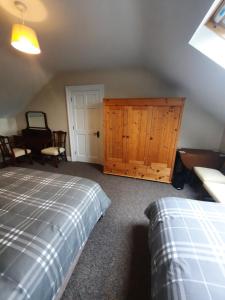 En eller flere senger på et rom på Clone manor Lodge