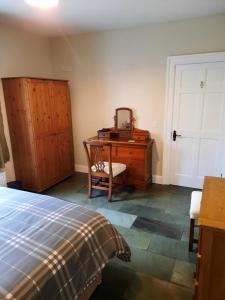 En eller flere senger på et rom på Clone manor Lodge