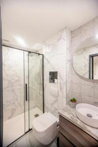 a bathroom with a shower and a toilet and a sink at Entre plages et centre-Ville in La Ciotat +10 photos