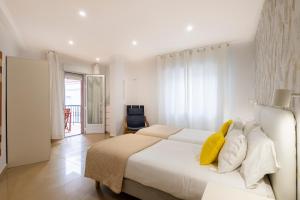 Ένα ή περισσότερα κρεβάτια σε δωμάτιο στο APARTAMENTOS TURISTICOS CASA SARITA - APARTAMENTOS A150 m DE LA PLAYA CANELIÑAS