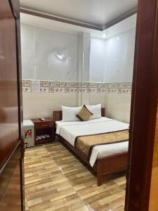 Postel nebo postele na pokoji v ubytování Sơn Tùng Motel