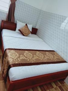 Postel nebo postele na pokoji v ubytování Sơn Tùng Motel