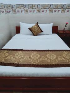 Postel nebo postele na pokoji v ubytování Sơn Tùng Motel