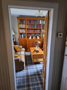 a living room with a couch and a table at The Old Schoolhouse in Ranish