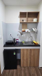 a kitchen with a sink and a counter top at Coconut Garden H in Phu Quoc