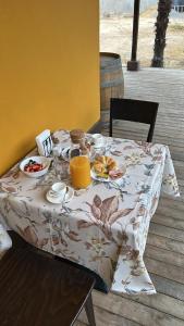 a table with breakfast food and orange juice on it at Casa Antigua Bed and Breakfast Chile in Casablanca +22 photos