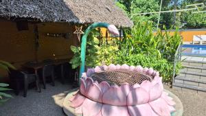 a pink cake sitting on top of a table at Swargam Pool Resort in Varkala +14 photos