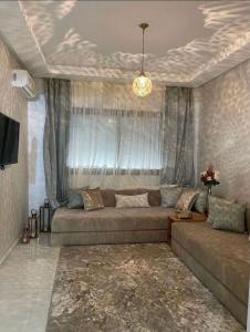 Posezení v ubytování Appartement avec piscine à El Mansouria