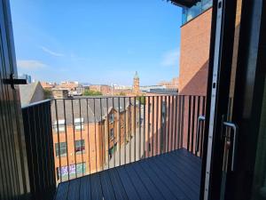 a balcony with a view of a building at 2 Bedroom Flat in Belfast in Belfast