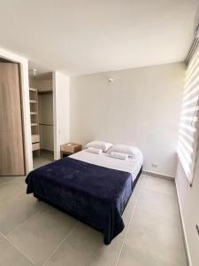 a bedroom with a large bed in a room at "Tu Escape en Cartagena" El Paraíso Caribeño! in Cartagena de Indias +16 photos
