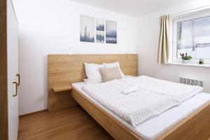 Posteľ alebo postele v izbe v ubytovaní Apartmány Malá Morávka