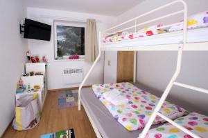 Posteľ alebo postele v izbe v ubytovaní Apartmány Malá Morávka