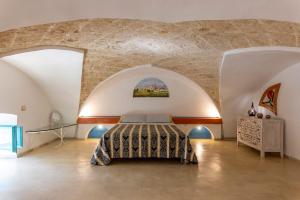 A bed or beds in a room at Corte Del Campanaro