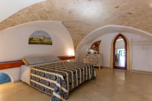 A bed or beds in a room at Corte Del Campanaro