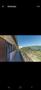 a picture of a building with a view of the beach at Apartman Alar in Pridraga