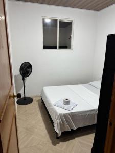 Postel nebo postele na pokoji v ubytování Apartaestudio, fresco y cómodo + 8 fotografií