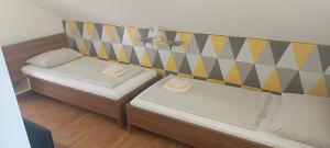 Postel nebo postele na pokoji v ubytování Pension Haus Nova