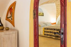 A bed or beds in a room at Corte Del Campanaro