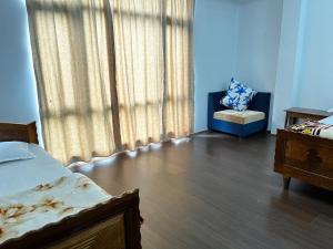Ένα ή περισσότερα κρεβάτια σε δωμάτιο στο Cliff Cottage homestay