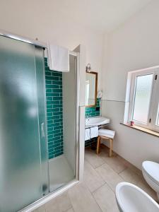 a bathroom with a shower and a sink at Hotel Dania in Sorrento +37 photos