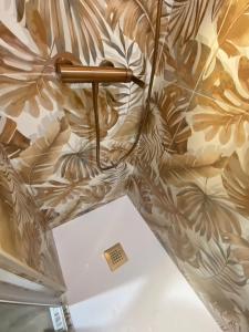 an umbrella is on display in a museum at Le Zen studio rénové in Balaruc-les-Bains