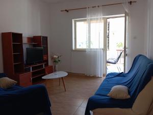 TV a/nebo společenská místnost v ubytování SunsetGardenBeach