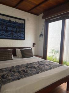 Postel nebo postele na pokoji v ubytování Hibiscus Beach Hotel & Villas