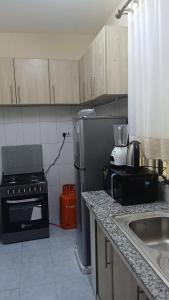 Η κουζίνα ή μικρή κουζίνα στο Blue-orchid House