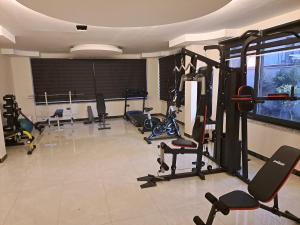 a gym with several exercise equipment in a room at Neridabeachhomes 20 in Alanya