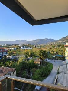 a view from a balcony of a town with a street at Neridabeachhomes 20 in Alanya