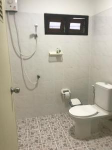 a bathroom with a toilet and a shower stall at Chiltern cottages in Amphoe Koh Samui +5 photos