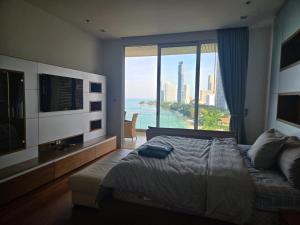 Ένα ή περισσότερα κρεβάτια σε δωμάτιο στο Premium Oceanview Condominium +99 φωτογραφίες