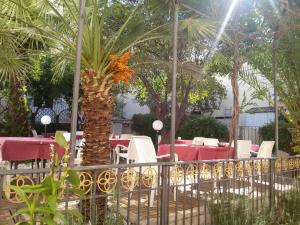 A garden outside Corte Cristina & Suites