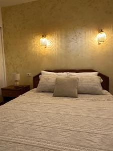 Postel nebo postele na pokoji v ubytování Villa Pietra